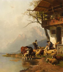 Troupeau de moutons au repos devant la maison au bord du lac de montagne